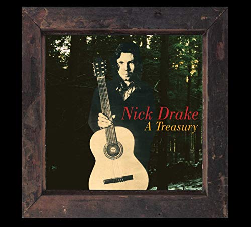 Nick Drake holding an acoustic guitar in a forest, framed by a wooden border.