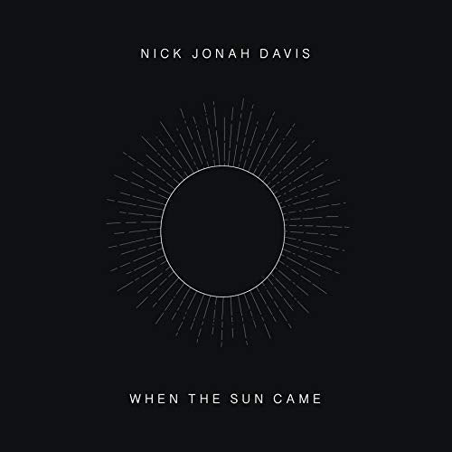 Album cover for Nick Jonah Davis’ “When The Sun Came” with sunburst design.