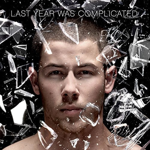 Nick Jonas portrait with shattered glass effect, album cover art.