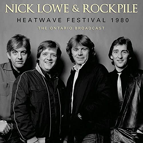 Black and white photo of Nick Lowe & Rockpile, four men posing.