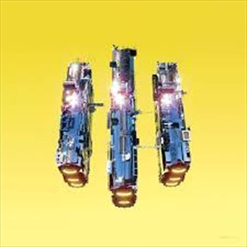 Yellow background with three abstract, metallic-looking shapes resembling vehicles.