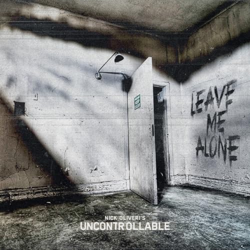 CD cover: a distressed room with graffiti reading "Leave Me Alone.