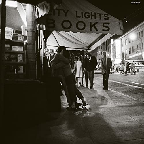 Black and white album cover with a couple embracing under a bookstore awning.