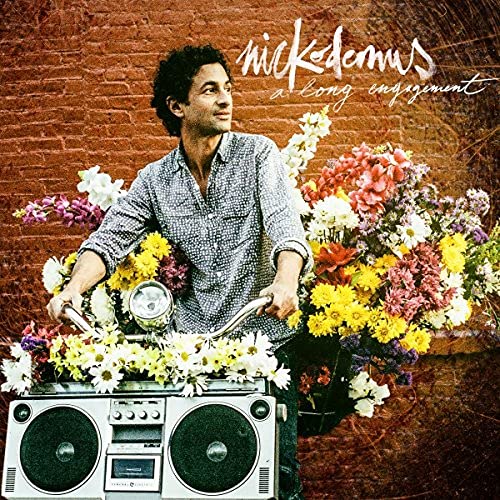 CD cover: man with flowers and a large boombox.