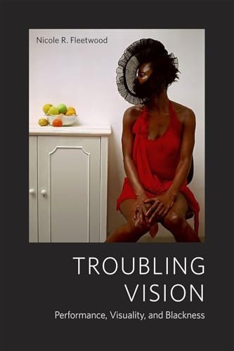Book cover: woman in red dress with netting over face.