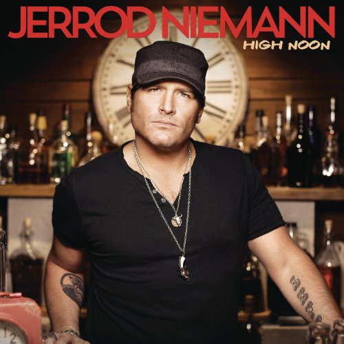 Jerrod Niemann wearing a cap and necklaces in front of a bar background.