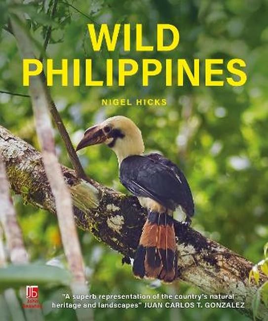 Book cover titled Wild Philippines featuring a hornbill perched on a tree branch.