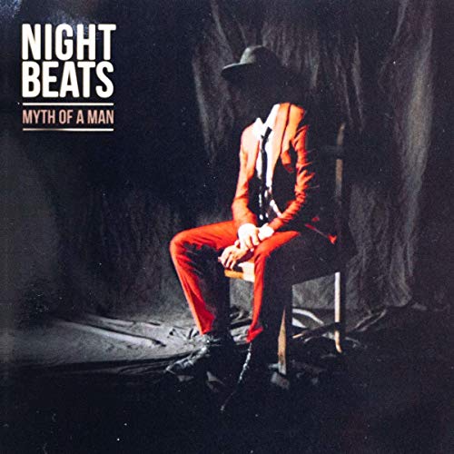 Night Beats album cover: man in suit sitting on chair.