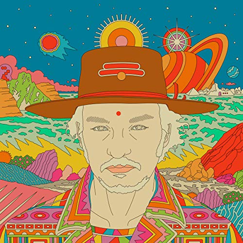 A man in a brown hat stands before a colorful, psychedelic landscape with planets.