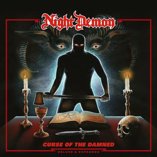 A hooded figure with glowing eyes stands behind a table with candles and skull.