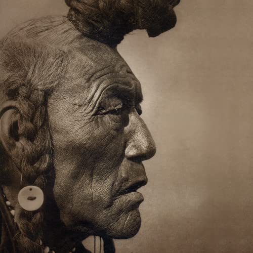 Sepia-toned portrait of a Native American man in profile with braided hair.