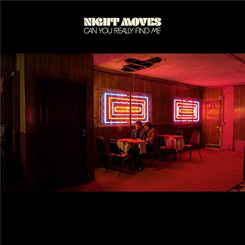 Album cover: two figures sit at a table in a dimly lit, red-toned room.