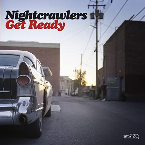 Nightcrawlers album cover: car rear view, urban street, sunset sky.