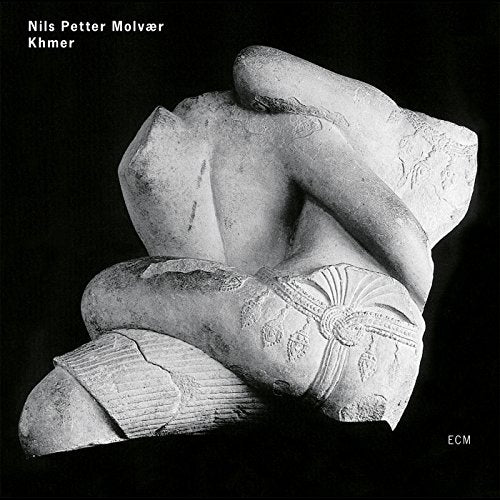 Black and white album cover featuring a fragmented stone sculpture.