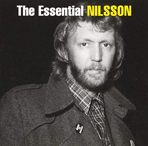 Black and white portrait of Harry Nilsson with beard and plaid shirt.