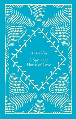 Blue book cover with white floral design and title "A Spy in the House of Love".