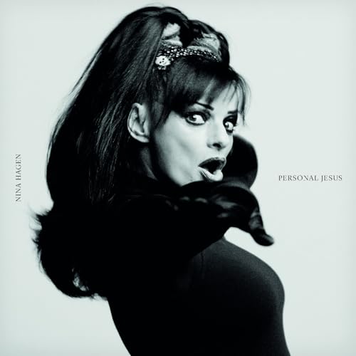 Black and white portrait of Nina Hagen looking over her shoulder with surprised expression.