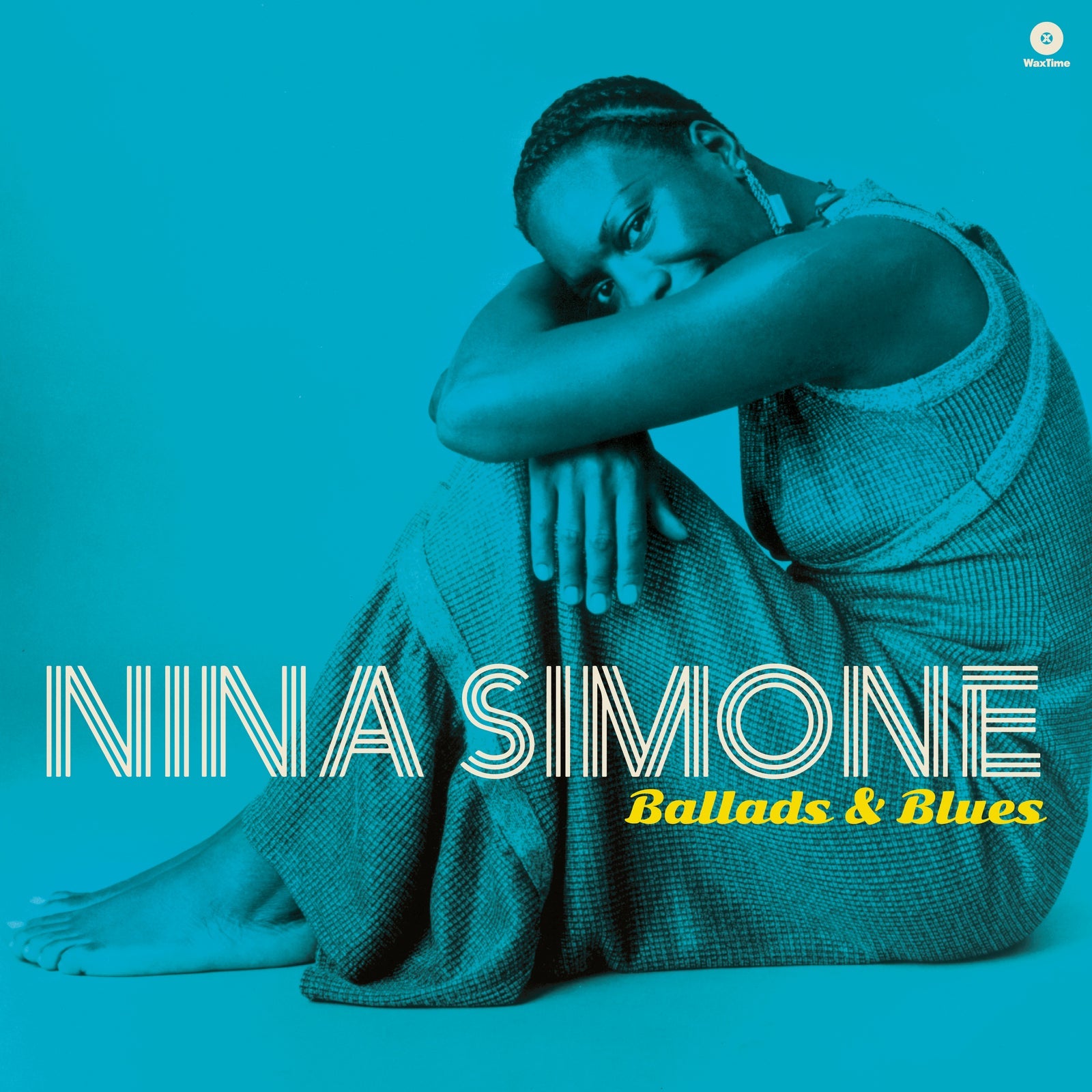 Nina Simone sitting in a teal-toned album cover for Ballads and Blues.