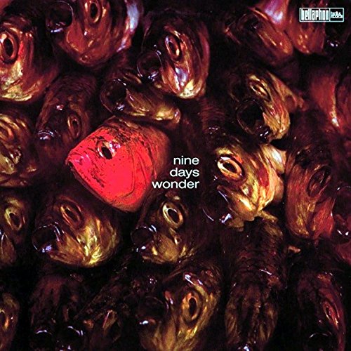 Album cover with many fish heads, one highlighted in red.