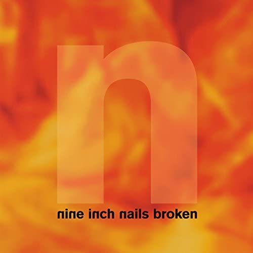 Nine Inch Nails “Broken” album cover with a blurry orange and white ‘n’.