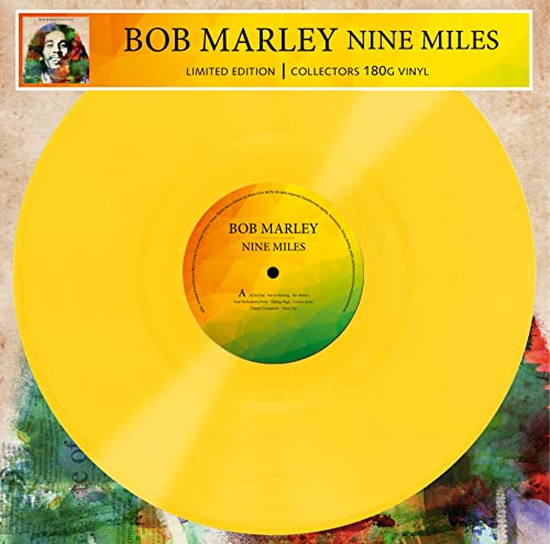 Bright yellow vinyl record with a colorful geometric center label featuring Bob Marley text.
