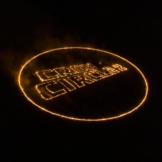 "Image of a lit crop circle with 'Crop Circle 2' text at night."