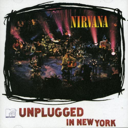 Nirvana’s “MTV Unplugged in New York” CD cover with band performing onstage.