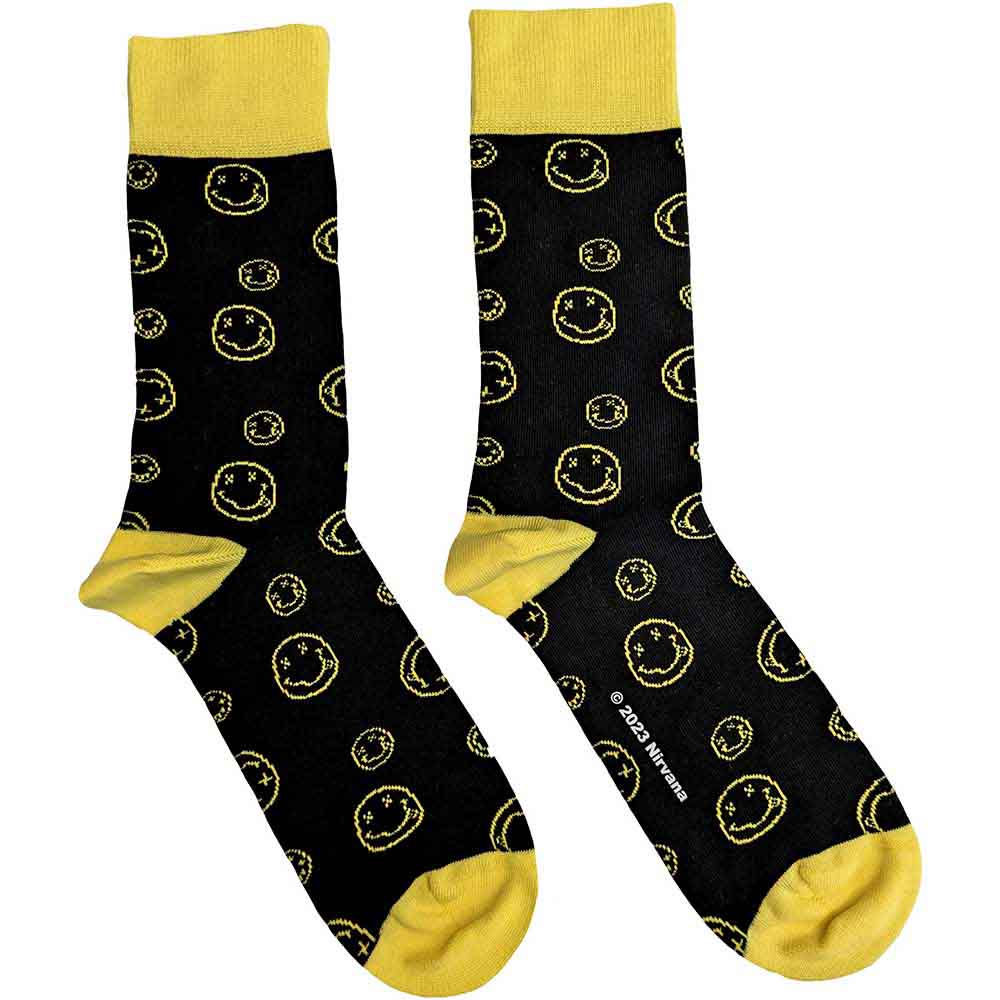 Ankle socks with repeated black outline drawings of smiling faces, UK size 7-11.