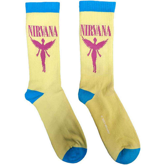 A pair of unisex terry socks in a light, angelic color with ribbed cuffs.