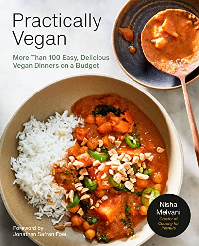 Cookbook cover with a bowl of curry, rice, and peanuts.