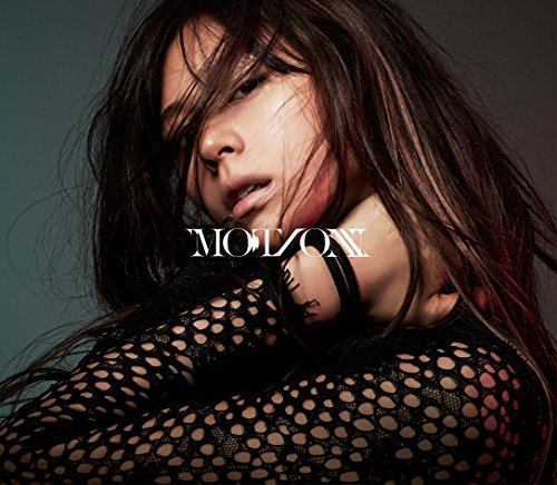 A woman with long dark hair wears a black mesh top with Motion text overlay.