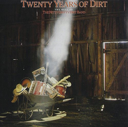 CD cover: wheelbarrow with instruments in a weathered barn interior.