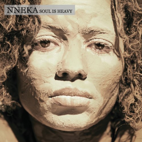 Close-up portrait of Nneka on the album cover “SOUL IS HEAVY.”