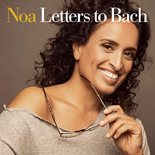 Noa, a smiling woman with curly hair, album cover for "Letters to Bach".