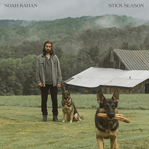 Noah Kahan album cover with a man, two dogs, and a barn.