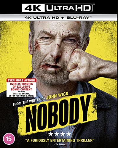 Blu-ray cover art featuring a bruised man being punched against a yellow background.