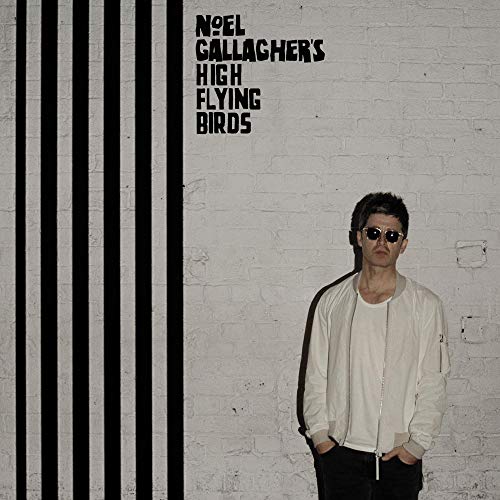 Album cover featuring Noel Gallagher in sunglasses, standing by striped wall.