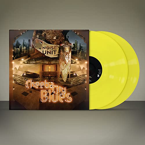 Two yellow vinyl records and cover with cityscape, insect, and neon text.