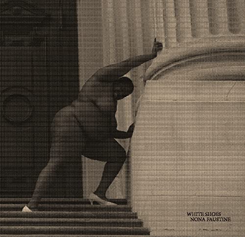 Black and white photo of a person straining against a curved wall.