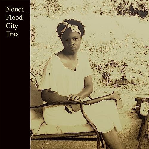 Vinyl record cover featuring a portrait of a woman with an axe.