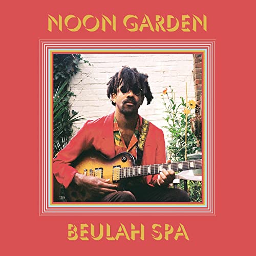 Man with guitar on red background with yellow text and border.