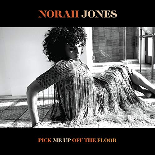 Norah Jones album cover, black and white portrait of a woman reclining.