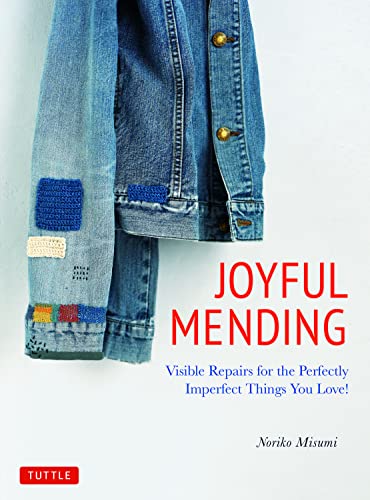 Denim jacket with visible mending, book cover for "Joyful Mending.