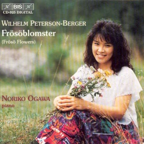 CD cover featuring Noriko Ogawa smiling and holding a bouquet of wildflowers.