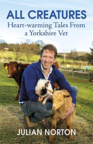 Book cover featuring a vet with a piglet and kid goat.