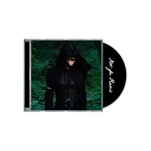 CD case with a person in black clothing against a green forest backdrop.