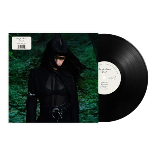 Vinyl record and album cover featuring a person with long dark hair.