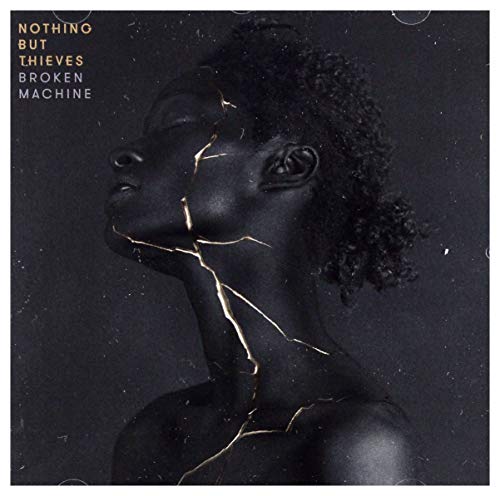 CD cover: dark-skinned face with golden cracks, album title "Broken Machine".