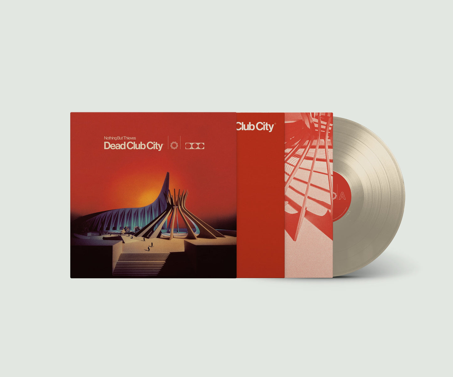 "Album cover with red artwork, partially covering a silver vinyl record."