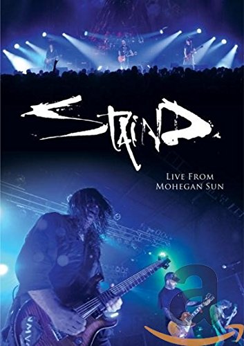 "STIND concert DVD cover with musicians performing on stage, bright stage lights."